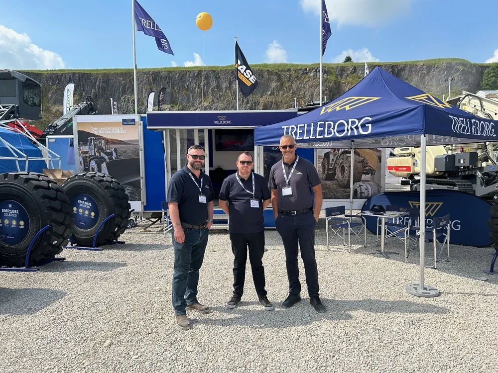 The Trelleborg Tyre team at Hillhead in front of their exhibition in a quarry