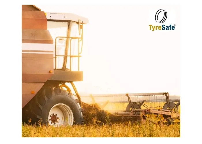 Front side view of a combine harvestor in a field for TyreSafe's promotion