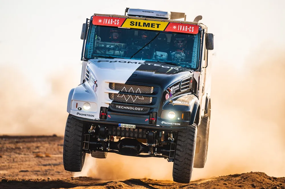 Front View of Truck on the Dakar Rally Jumping a Sand Dune