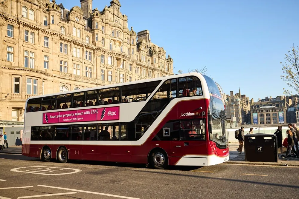 Image of a Lothian bus in maroon in Scotland
