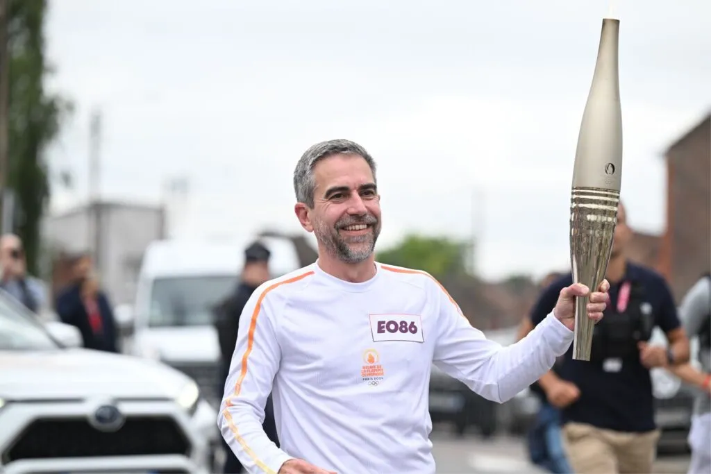Andy Mathis, Head of Marketing at Bridgestone EMEA holding the Olympic torch